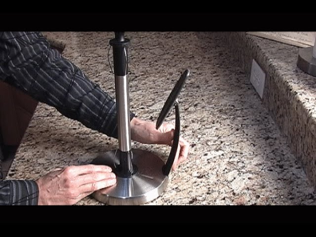 SimplyTear Paper Towel Holder has a Spring activated arm to hold the roll securely and allows for a one handed tear